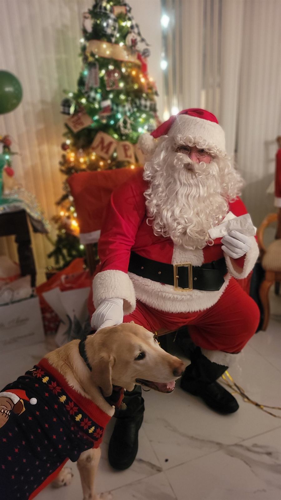 Papa Noel with a family dog