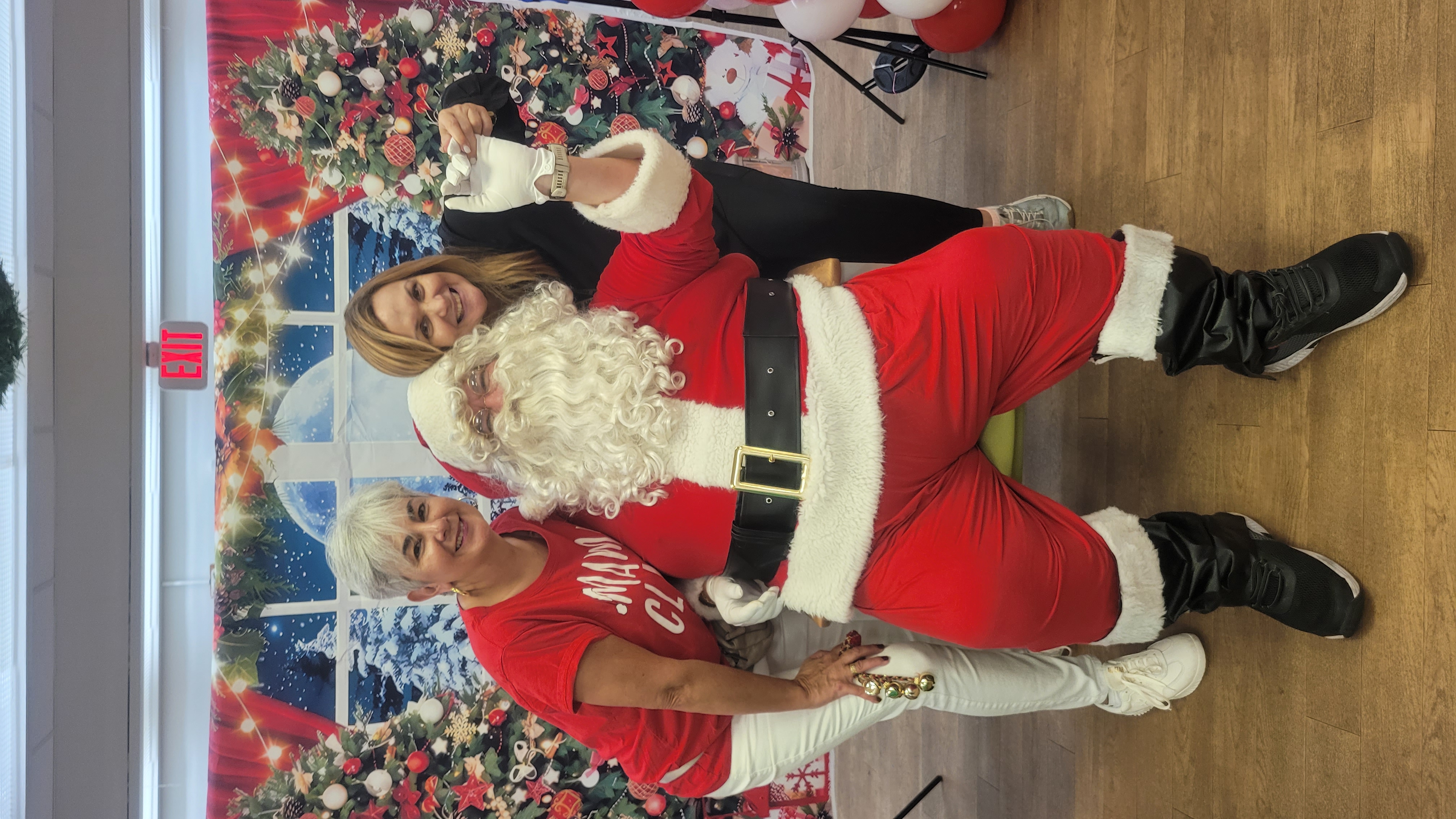 Papa Noel posing for Christmas photos with guests